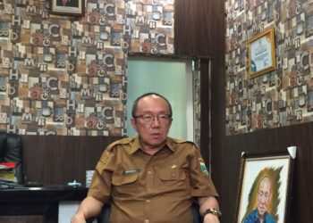 Kepala Dinas Kesehatan Kabupaten Malang, Wiyanto Widjoyo saat ditemui Blok-a.com di ruang kerjanya (Blok-a.com / Putu Ayu Pratama S)